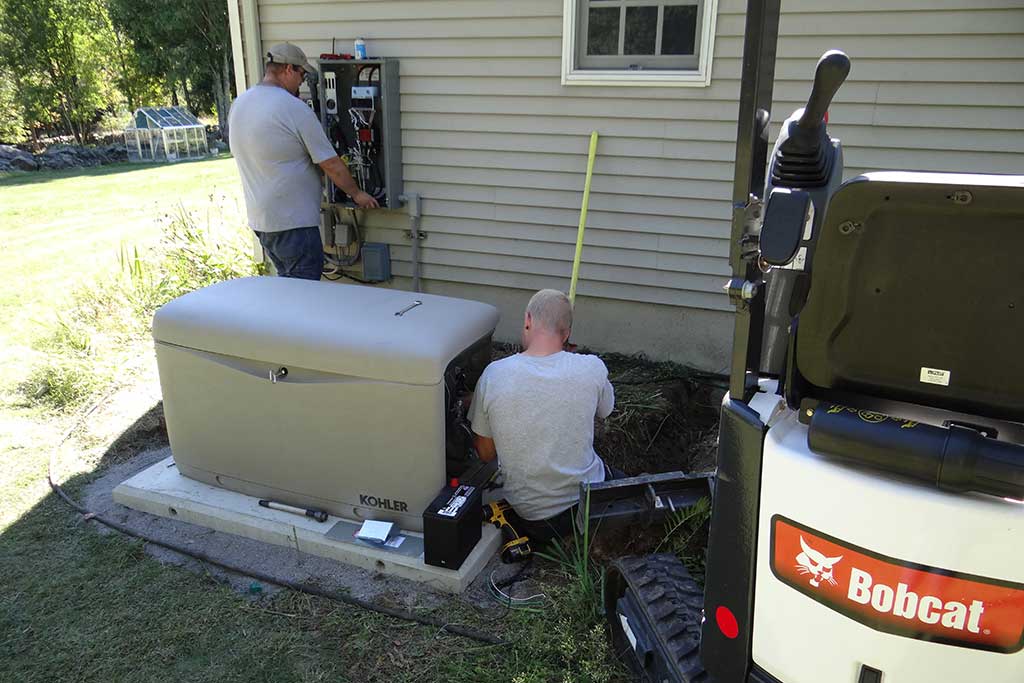 There is No Substitute for Experience Two generator technicians complete the last phase of installing a residential generator