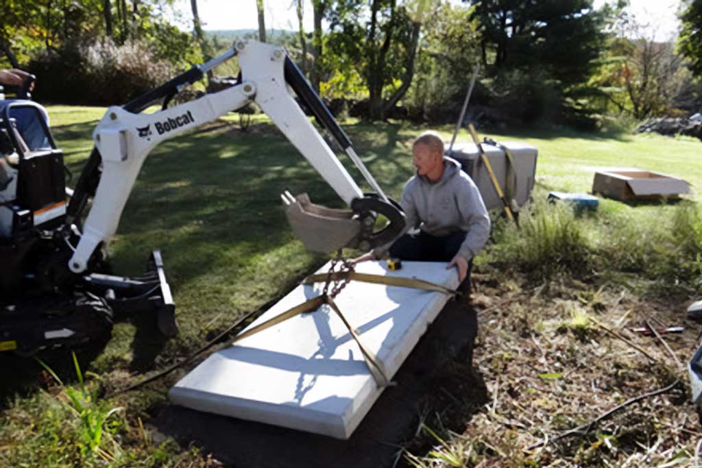 Installing Generator Pad Gen Plus technician lowering generator pad